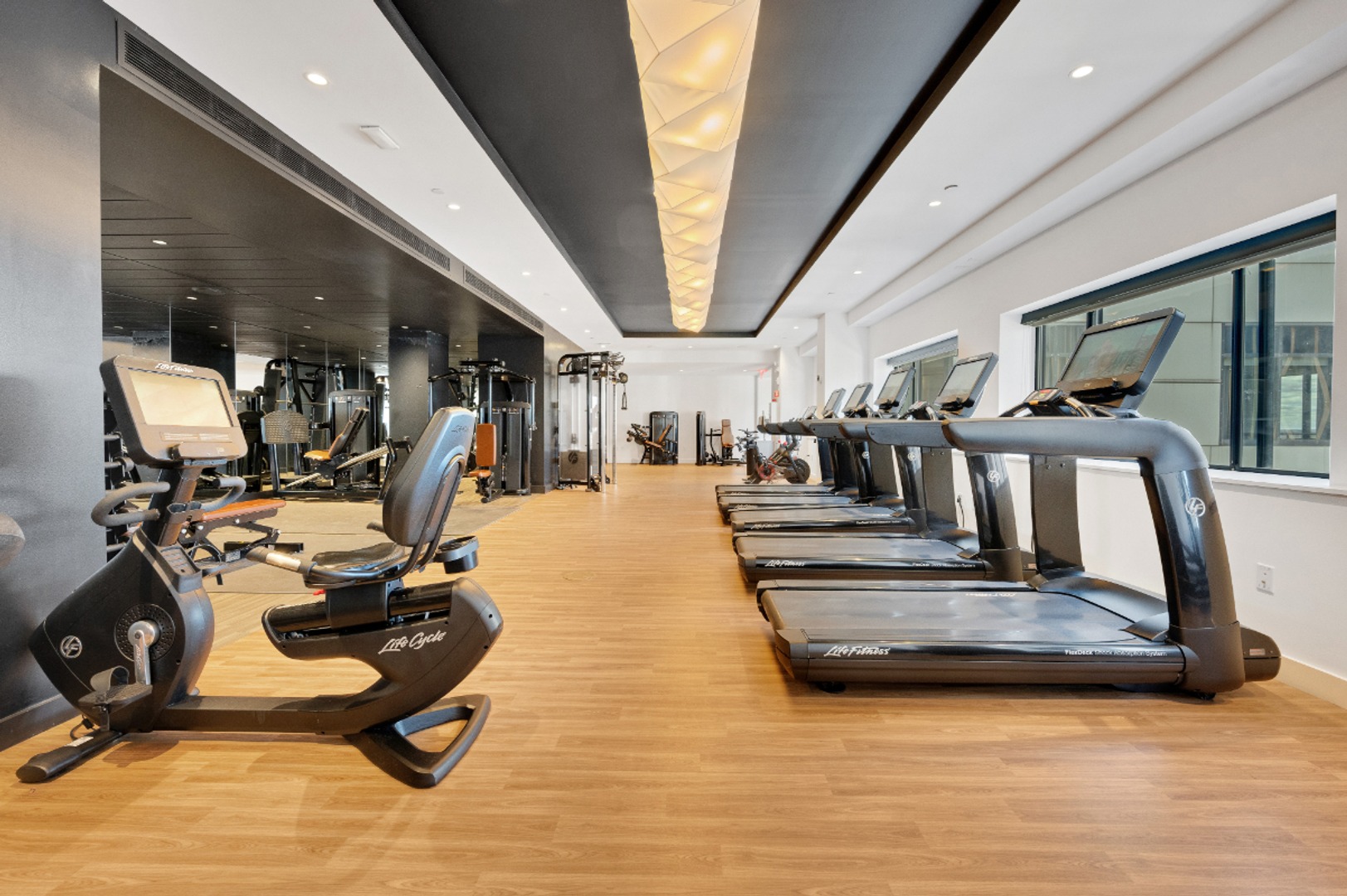 Cardio machines in fitness center.