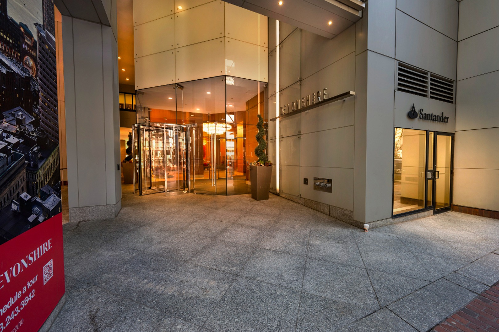 Alternate view of building entrance with revolving door.