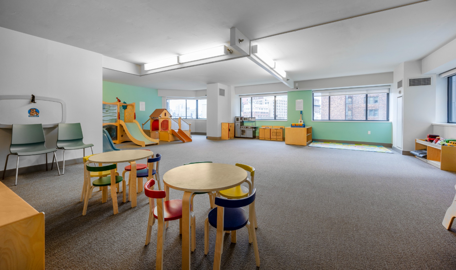Alternate view of playroom with tables.