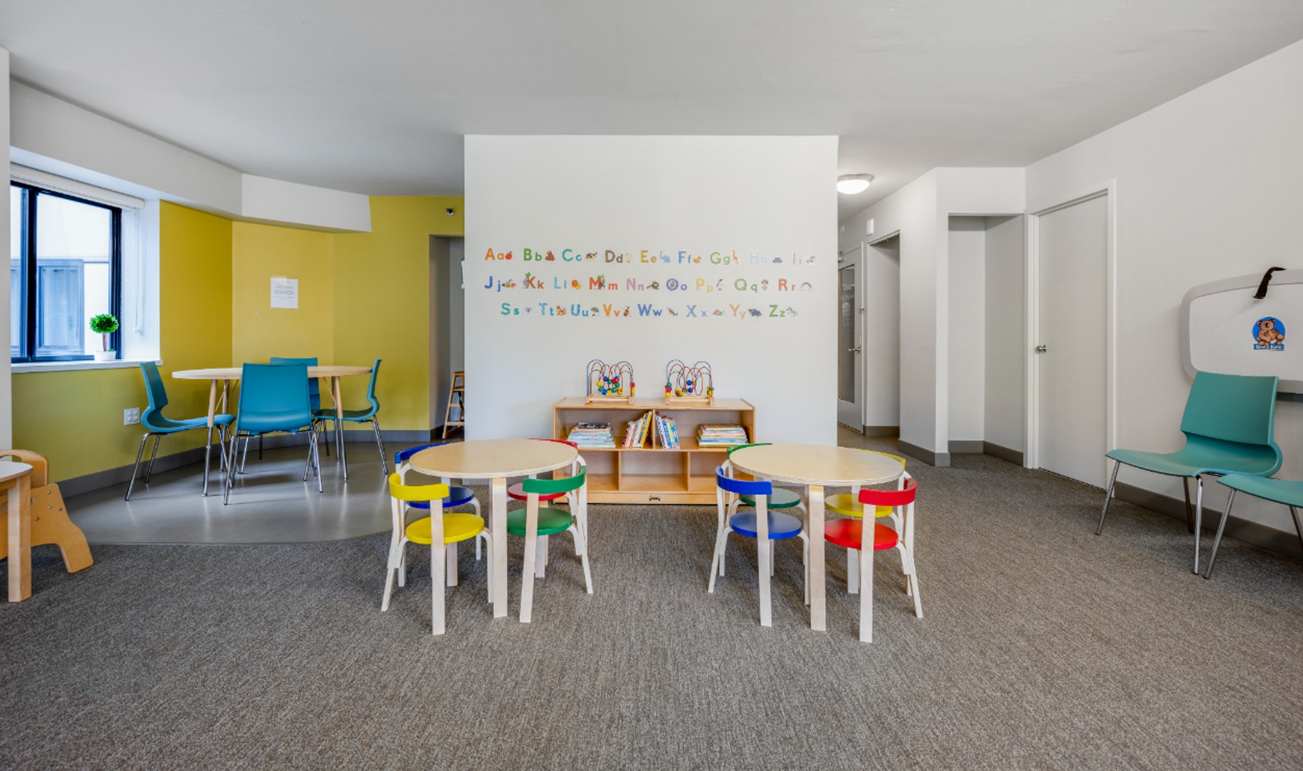 Kids’ playroom with tables.
