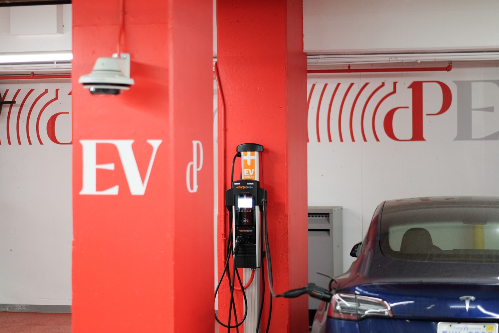 EV charging station in parking garage.