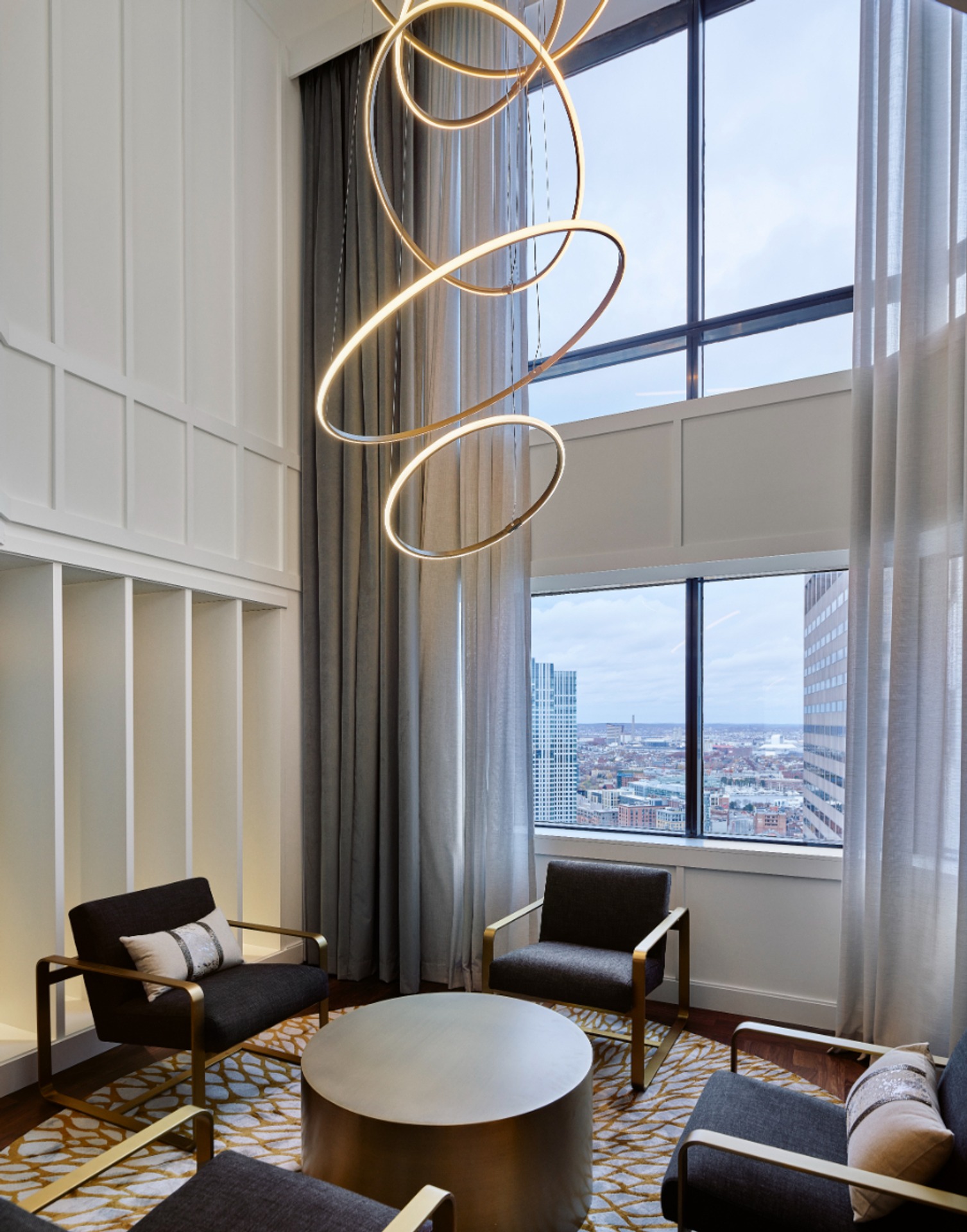 Sky lounge with chandelier and seating.