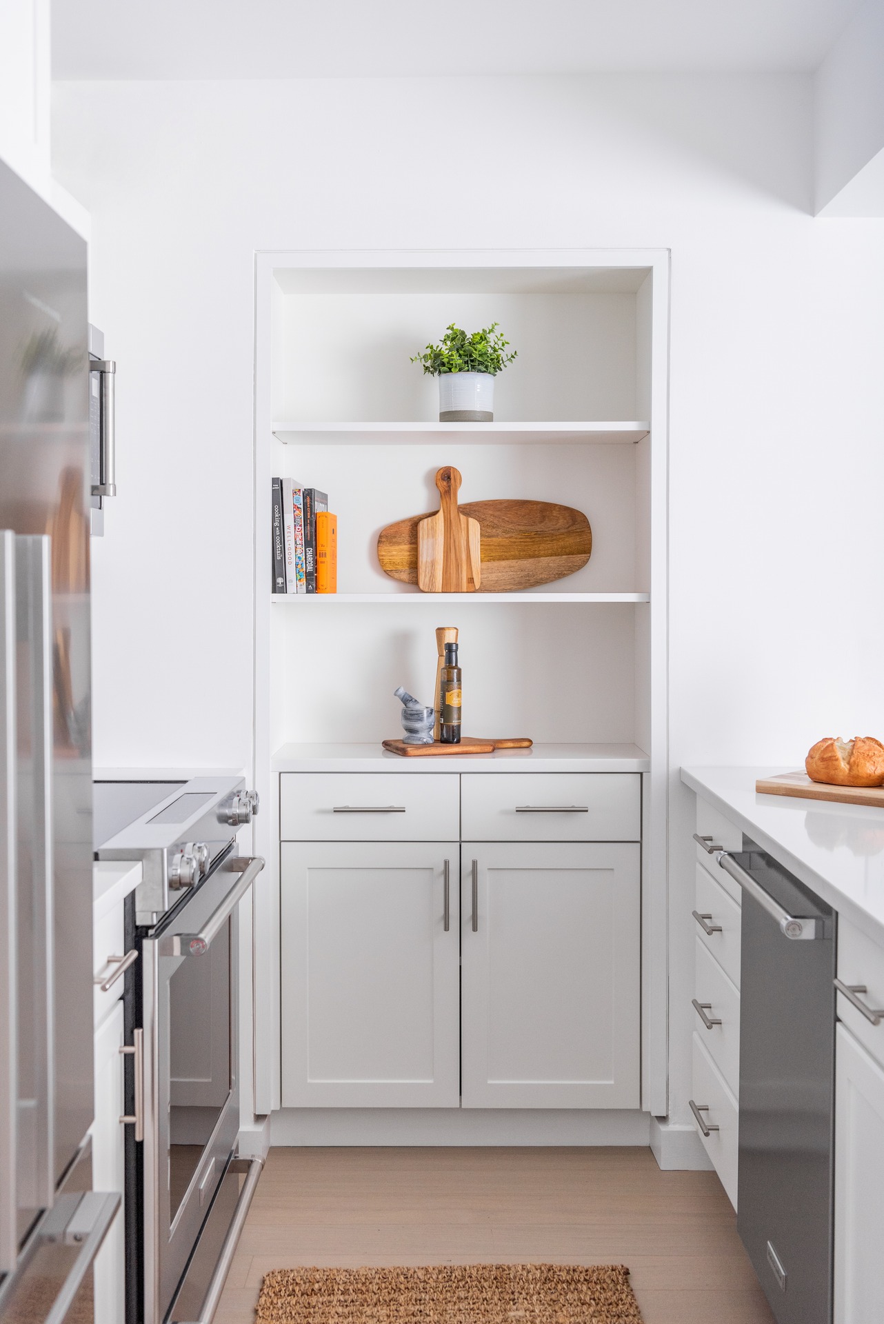 One bedroom kitchen with stainless steel appliances.