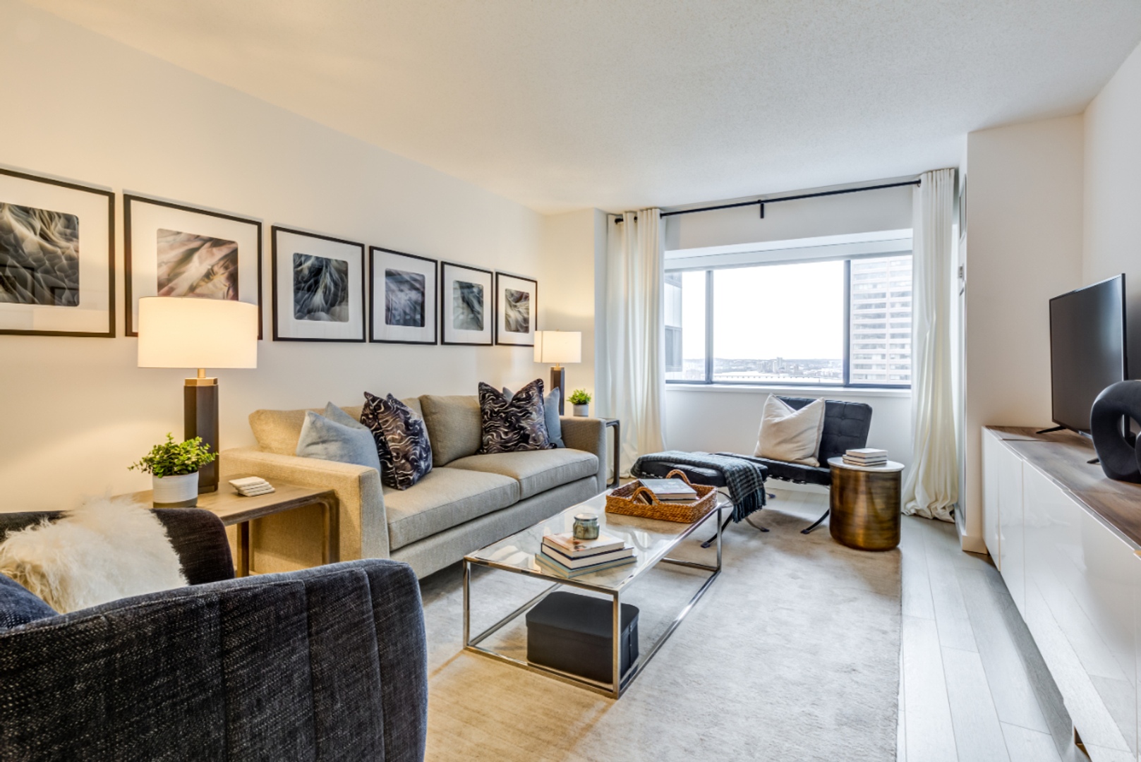 One bedroom living room with large windows.