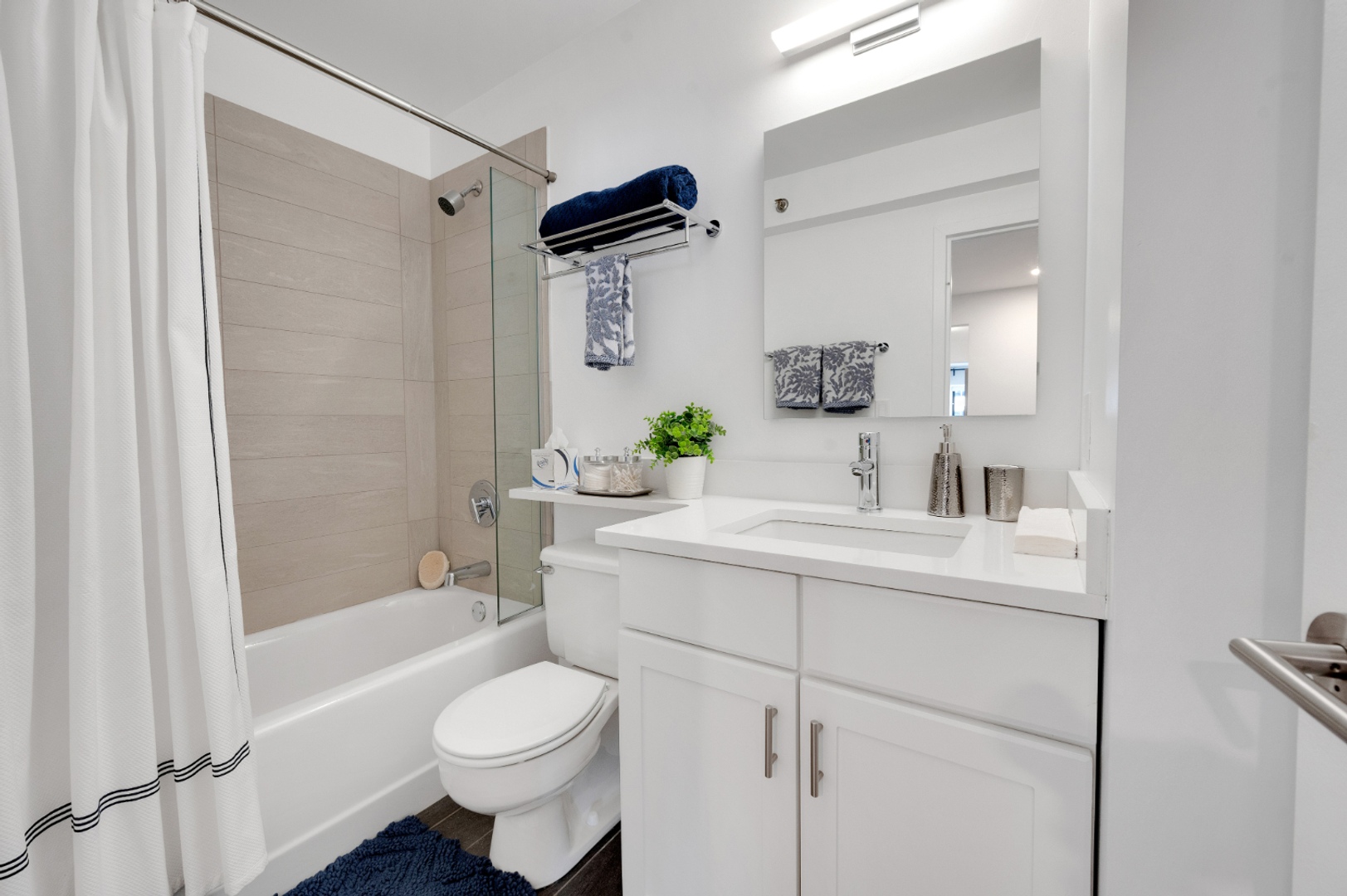 Bathroom with shower, tub, and vanity.