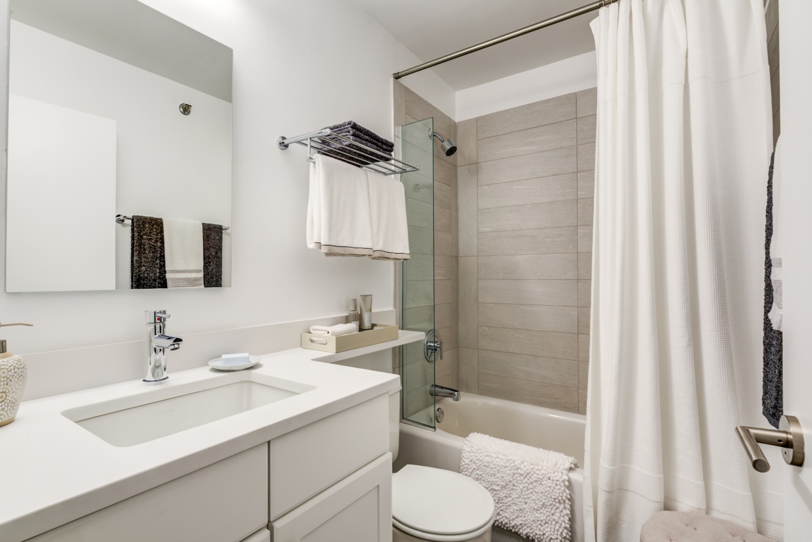 Bathroom with shower, tub, and vanity.